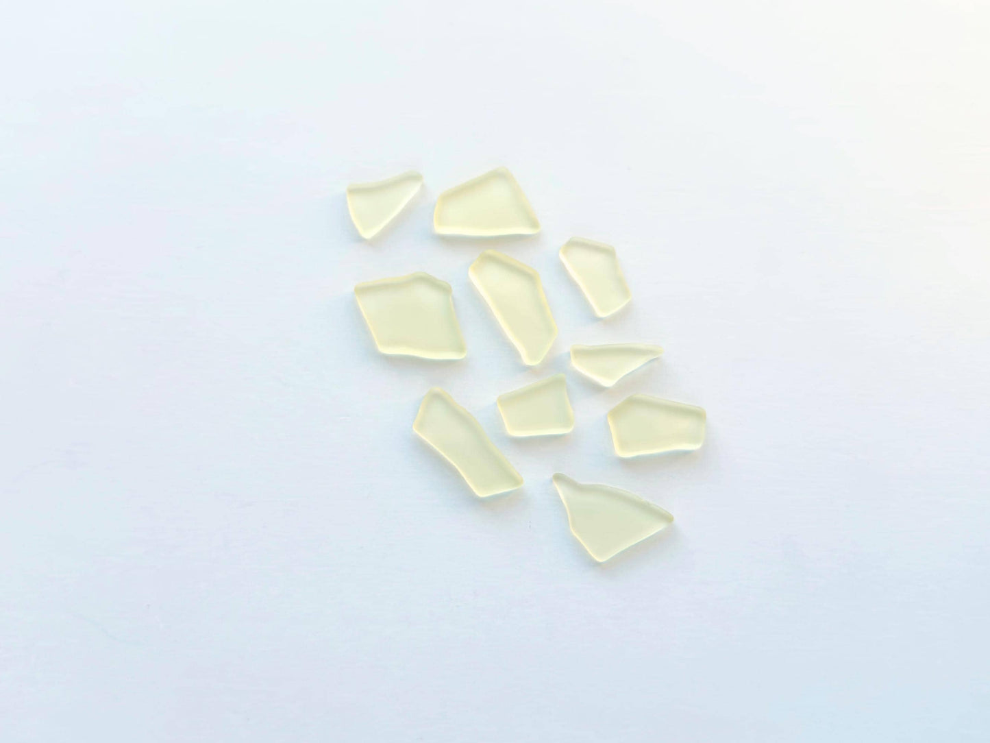 Buttercream yellow tumbled sea glass pieces with smooth frosted edges in small to medium sizes perfect for spring jewelry making mosaics resin art wedding decor and coastal home accents made from recycled vintage glass