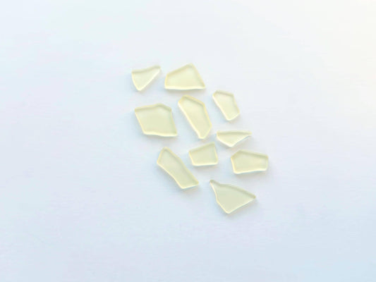 Buttercream yellow tumbled sea glass pieces with smooth frosted edges in small to medium sizes perfect for spring jewelry making mosaics resin art wedding decor and coastal home accents made from recycled vintage glass