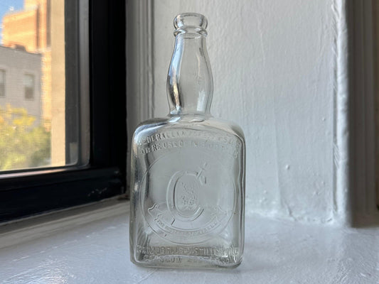 Campbell’s Scotch whisky bottle full front view, vintage clear glass with Federal Law embossing, 9.5 inches, NYC recovery