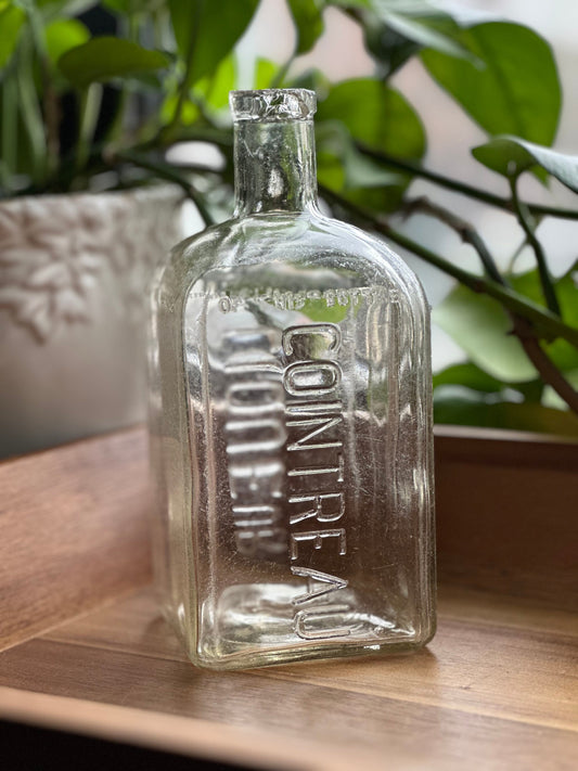 Cointreau 1951 square clear glass bottle full front view, NYC beach recovery