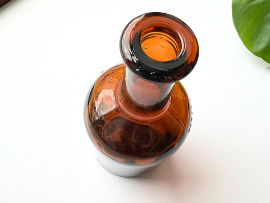 Drambuie bottle neck overhead view showing amber glass shoulder