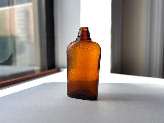 Federal Law wide-shoulder amber flask full front view, 7.75 inches tall with moderate seaworn patina, NYC recovery