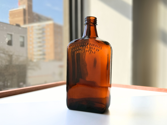 Geo. Ballantine and Sons amber glass bottle side view showing deep warm amber color and excellent clear glass condition