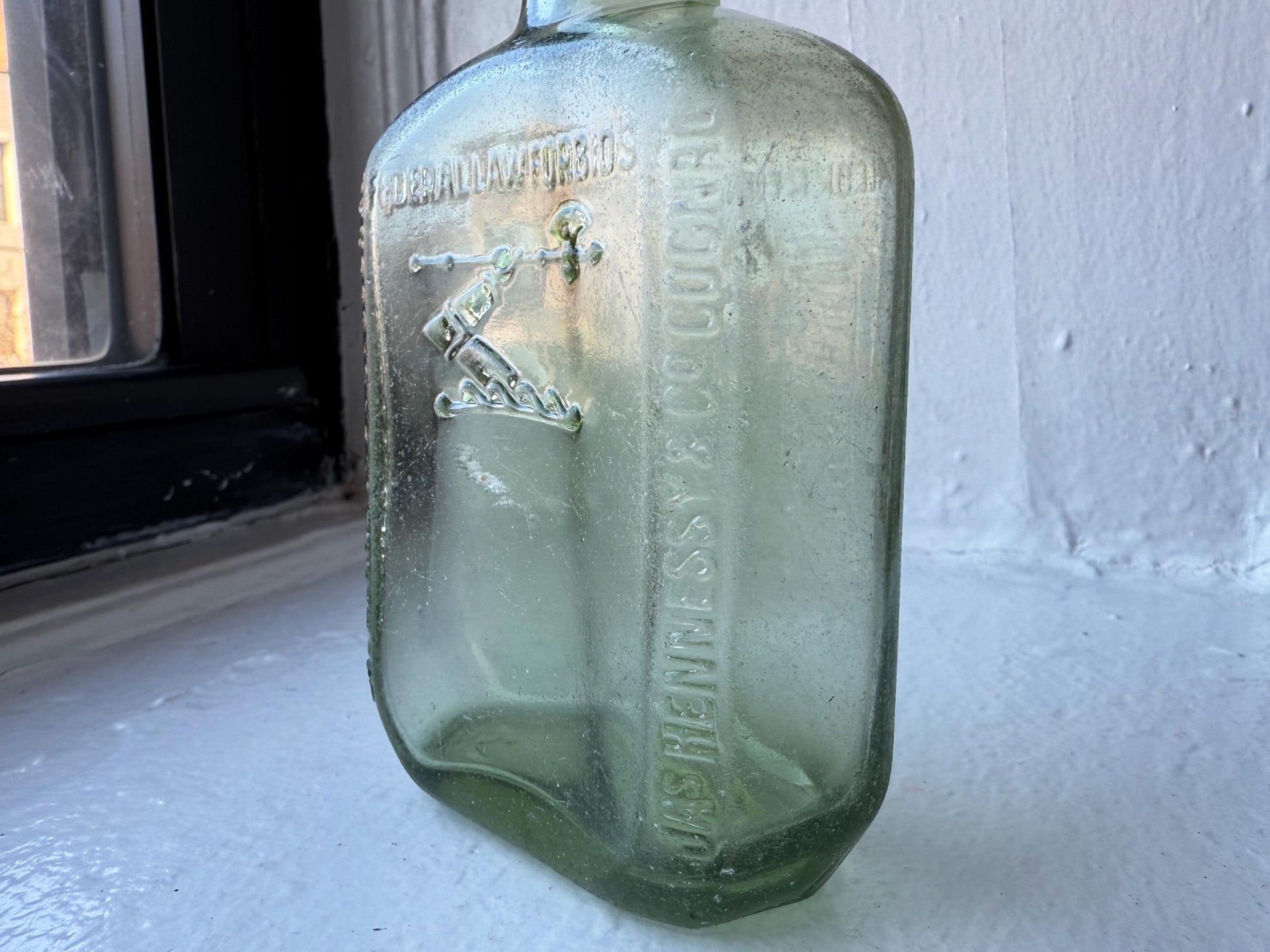 Hennessy bottle base detail showing Bottle Made in France 1938 marking, authentic French cognac glass