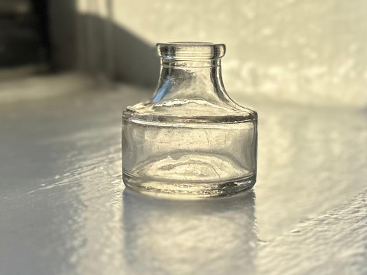 Higgins Ink jar full front view, clear glass squat cylindrical form with HIGGINS INK embossing, 2.5 inches, Brooklyn NY, NYC recovery