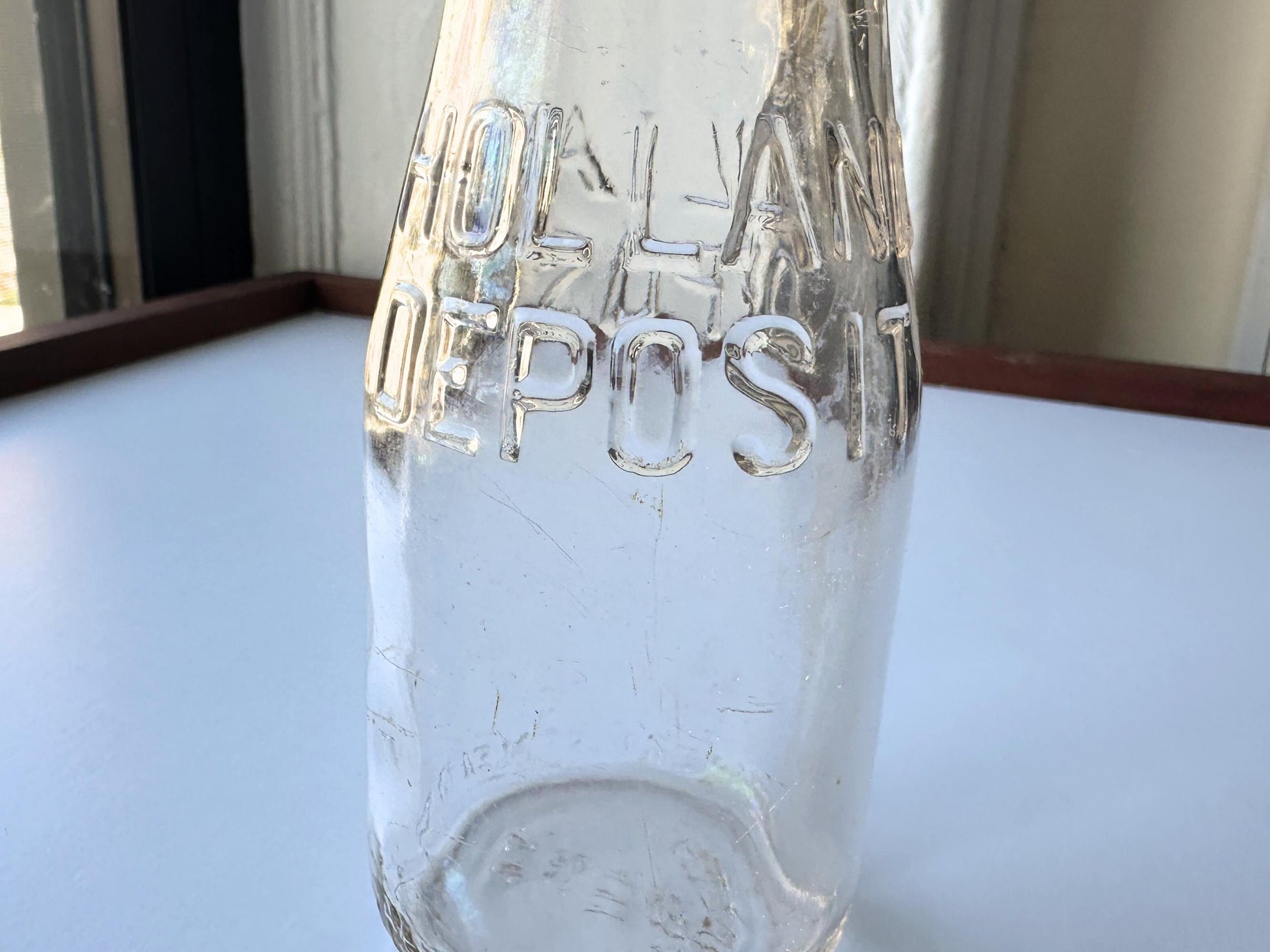 Vintage 1952 clear corktop bottle with distinctive cork-sealed top and production marking. Perfect for vintage kitchen collectors, farmhouse displays, apothecary decor, and cottagecore styling. Good condition clear glass bottle ideal for flowers, storage, or vintage collections.