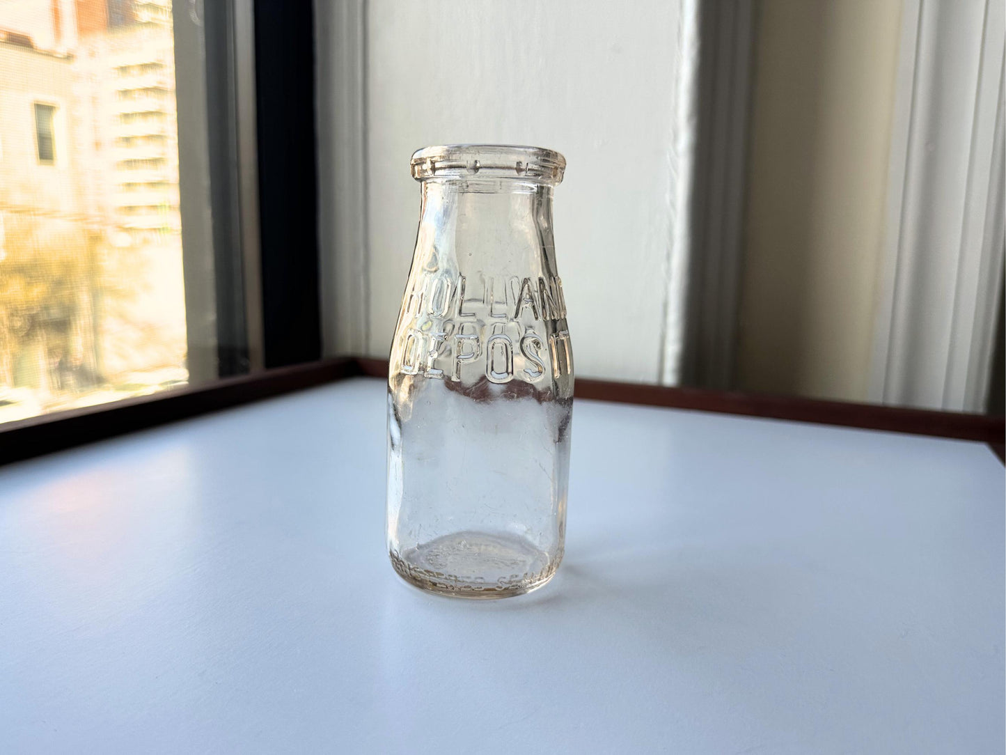 Vintage 1952 clear corktop bottle with distinctive cork-sealed top and production marking. Perfect for vintage kitchen collectors, farmhouse displays, apothecary decor, and cottagecore styling. Good condition clear glass bottle ideal for flowers, storage, or vintage collections.