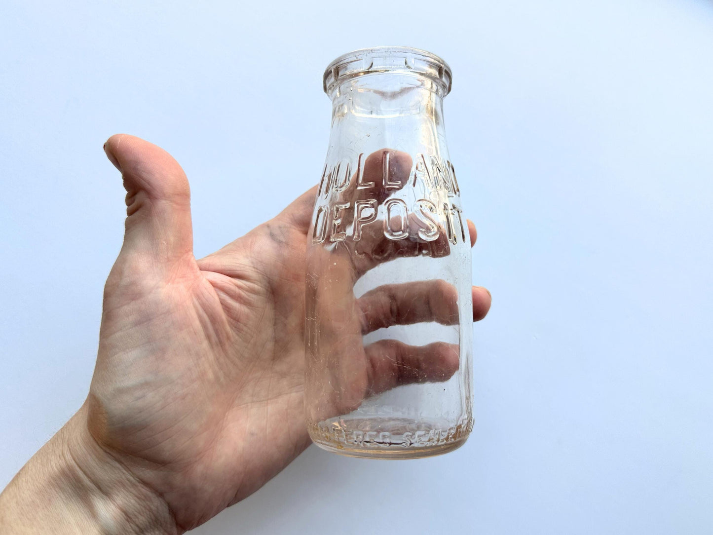 Vintage 1952 clear corktop bottle with distinctive cork-sealed top and production marking. Perfect for vintage kitchen collectors, farmhouse displays, apothecary decor, and cottagecore styling. Good condition clear glass bottle ideal for flowers, storage, or vintage collections.