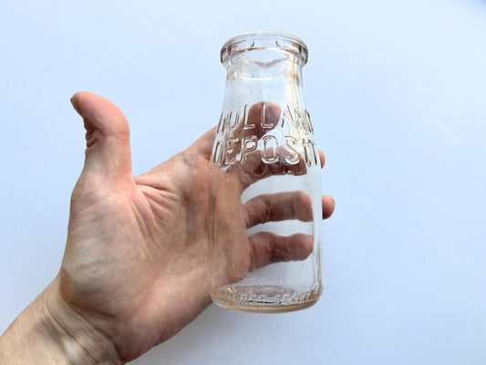 Vintage 1952 clear corktop bottle with distinctive cork-sealed top and production marking. Perfect for vintage kitchen collectors, farmhouse displays, apothecary decor, and cottagecore styling. Good condition clear glass bottle ideal for flowers, storage, or vintage collections.