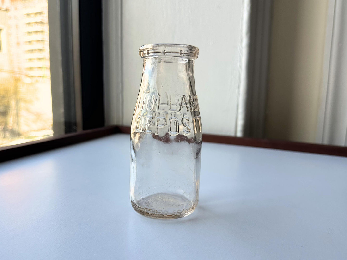 Vintage 1952 clear corktop bottle with distinctive cork-sealed top and production marking. Perfect for vintage kitchen collectors, farmhouse displays, apothecary decor, and cottagecore styling. Good condition clear glass bottle ideal for flowers, storage, or vintage collections.