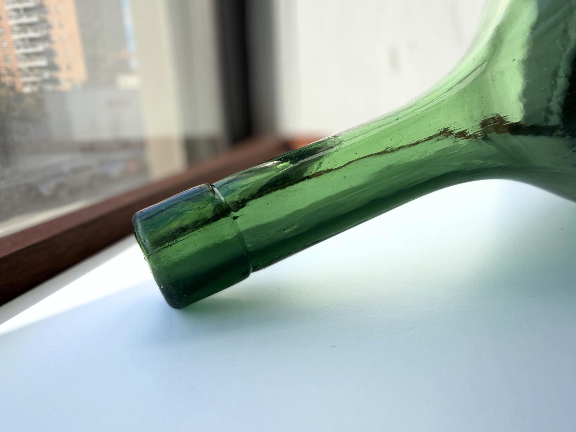 Huge vintage glass green round-bottom wine bottle, 15 inches tall, hand-recovered from NYC mid-century dumping grounds — authentic 1950s or earlier with pontil swirl base mark