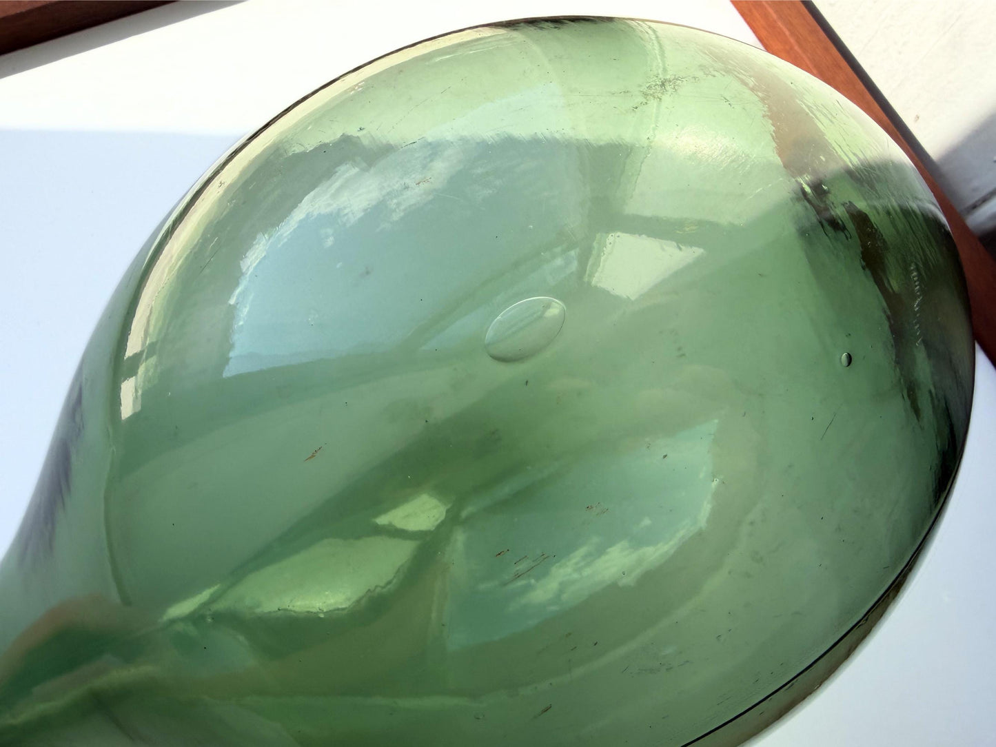 Huge vintage glass green round-bottom wine bottle, 15 inches tall, hand-recovered from NYC mid-century dumping grounds — authentic 1950s or earlier with pontil swirl base mark