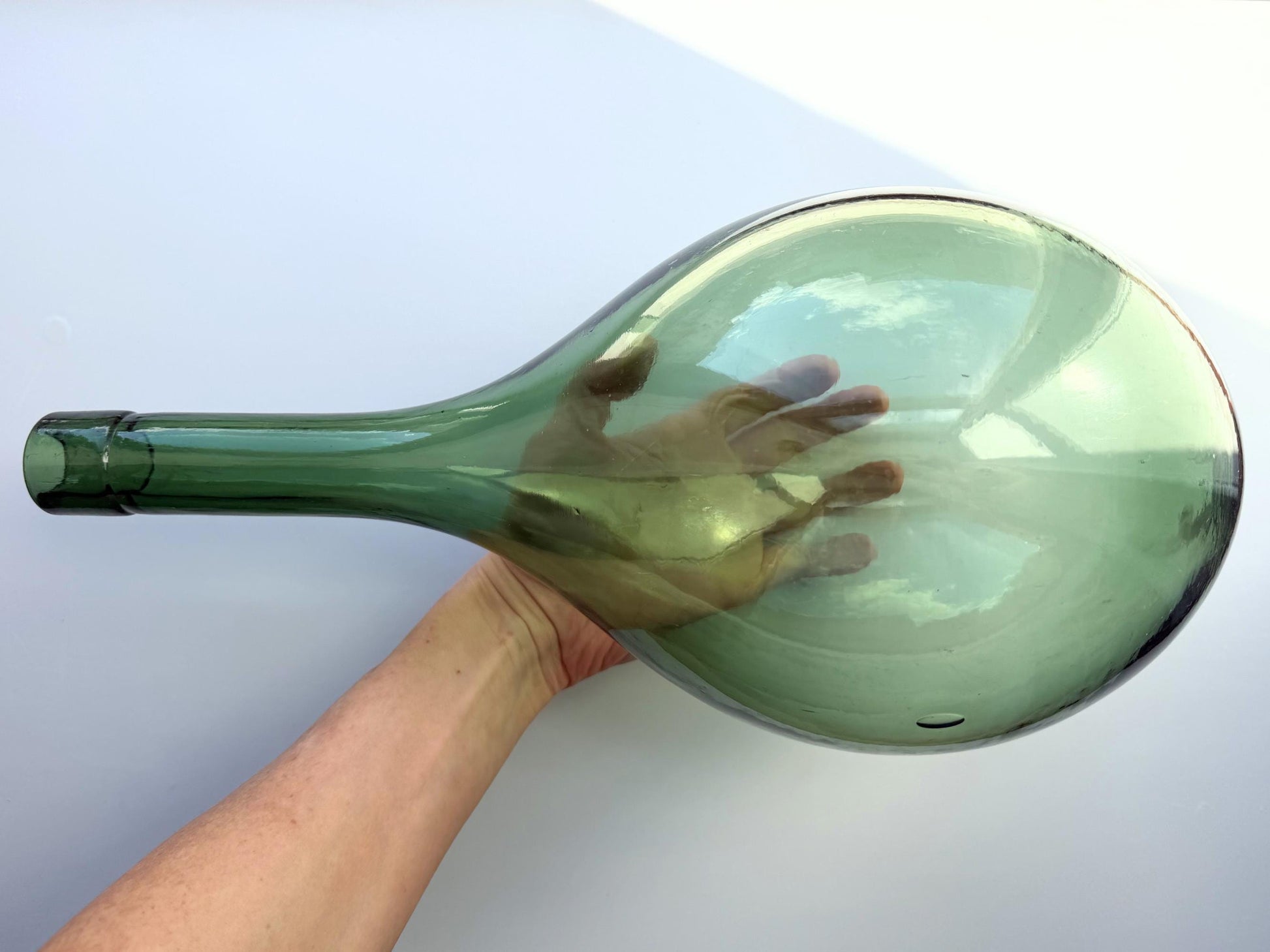 Huge vintage glass green round-bottom wine bottle, 15 inches tall, hand-recovered from NYC mid-century dumping grounds — authentic 1950s or earlier with pontil swirl base mark