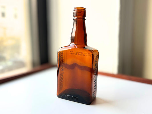 Mount Vernon bottle side view showing amber glass form and age-appropriate patina