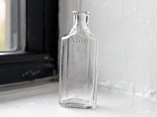 Owens Glass medicine bottle full front view showing 3iii embossing, early 20th century clear glass apothecary