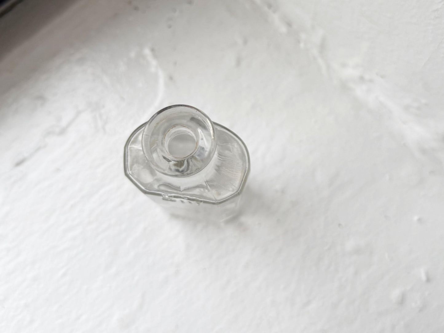 Owens Glass medicine bottle top view showing narrow neck and small opening, early 20th century pharmaceutical