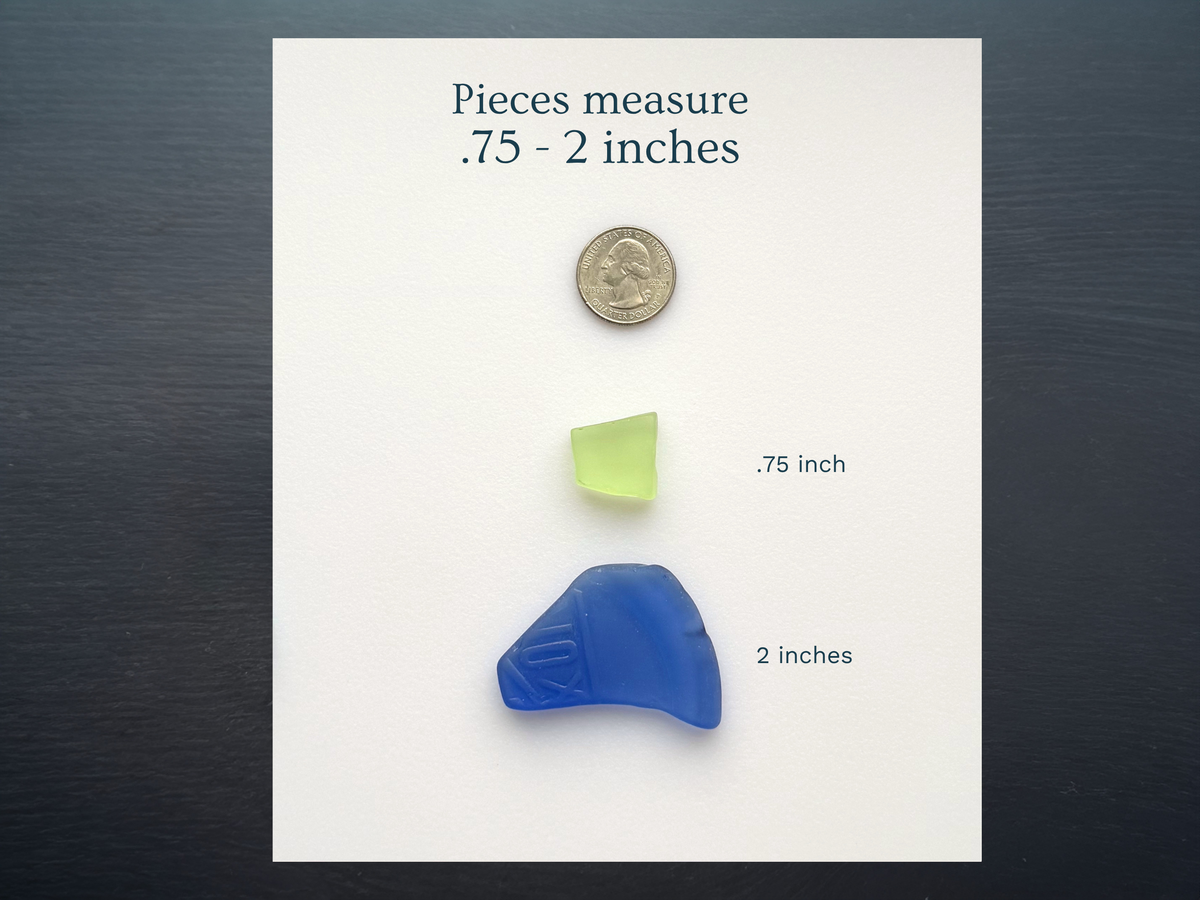 Large tumbled sea glass pieces from 0.75 to 2 inches wide shown next to a ruler for size reference when selecting anchor pieces for mosaic or resin work.