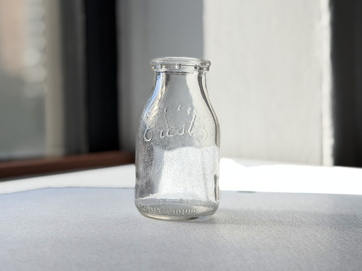 Silver Crest Dairy half pint milk bottle, side profile view