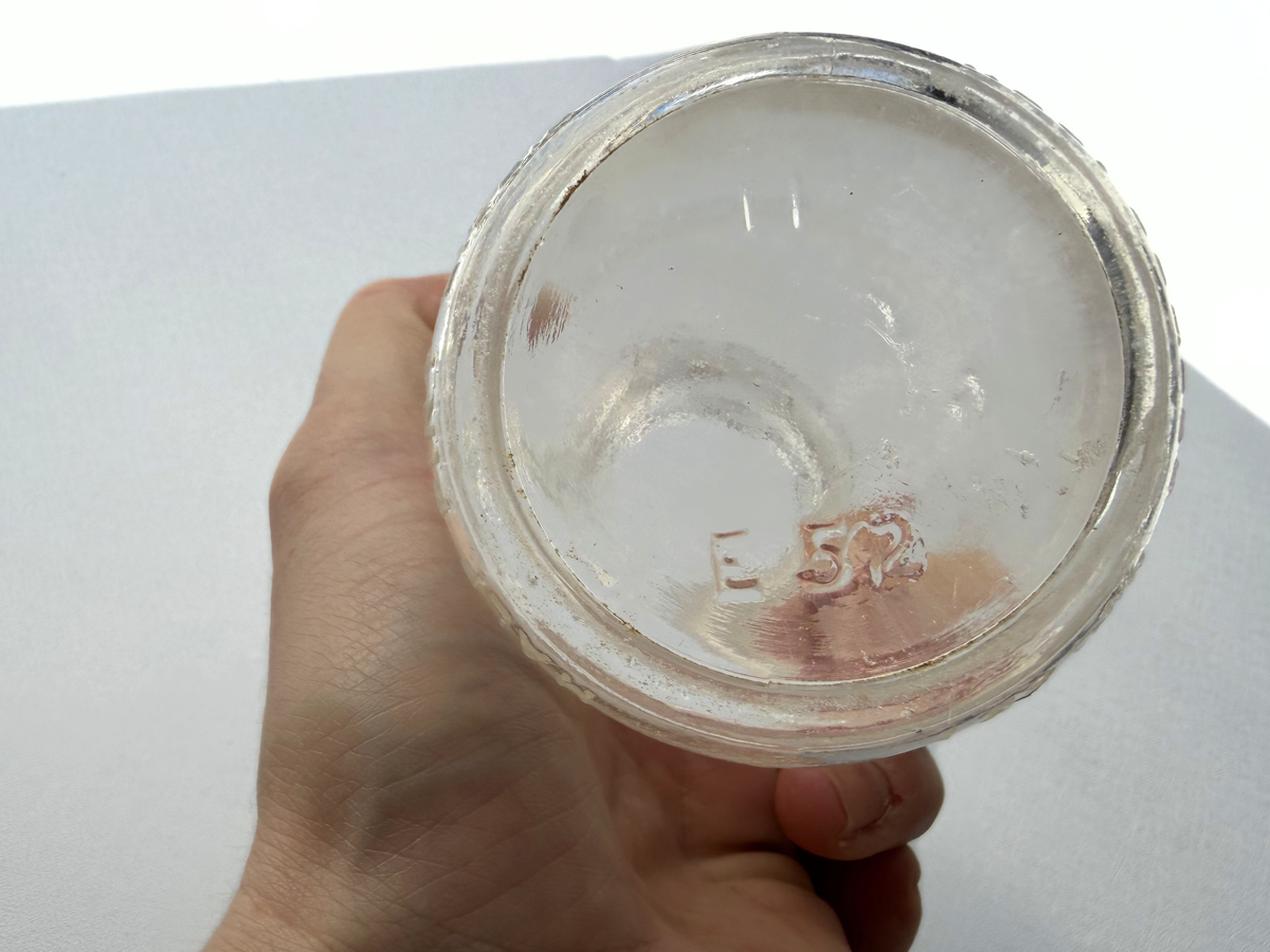 Base of Silver Crest Dairy milk bottle showing E 52 date code embossing