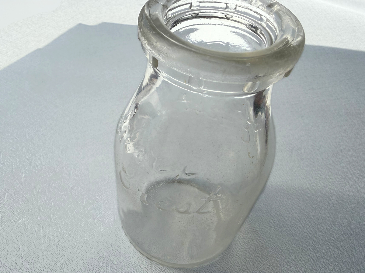 Close-up of Silver Crest Dairy milk bottle mouth and neck rim