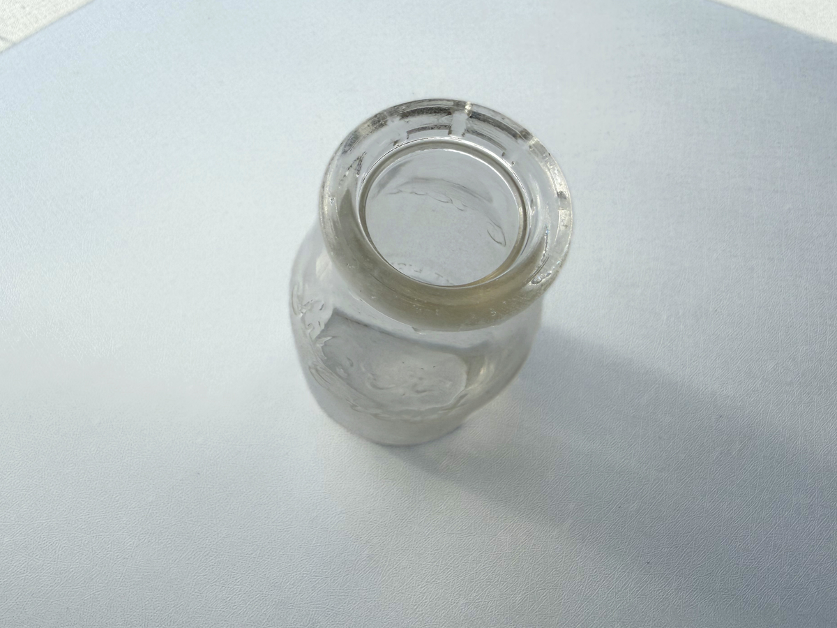 Top-down view of Silver Crest Dairy milk bottle opening and neck