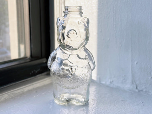 Vintage clear glass piggy bank full side view, 1950s embossed MCM novelty collectible 7.75 inches
