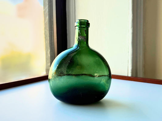 Vintage olive green onion bottle full front view, hand-blown globular form 7 inches tall NYC recovery